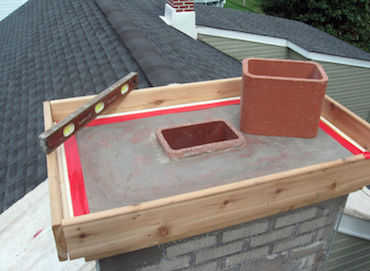 Picture of a freshly repaired chimney crown in Omaha.